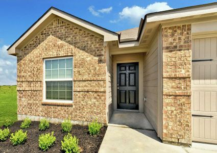 Close-up of Frio entryway featuring window, garage and covered porch.