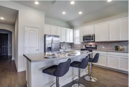 Photo of Pulte model home with same floor plan, not of actual home listed.