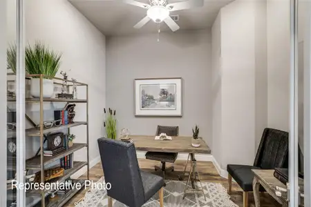 Office with ceiling fan and wood-type flooring