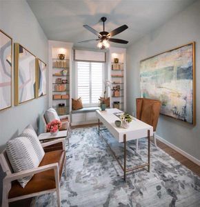 In the hallway into the living space is the study styled with barn doors