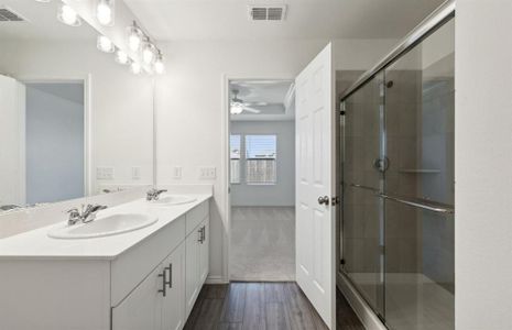 Elegant owner's bathroom with oversized shower*real home pictured