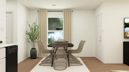 Dining space with light hardwood / wood-style flooring