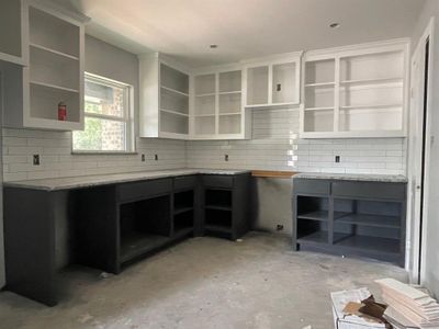 Kitchen with light stone countertops