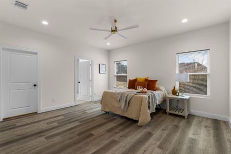 Bedroom featuring dark hardwood / wood-style floors and ceiling fan