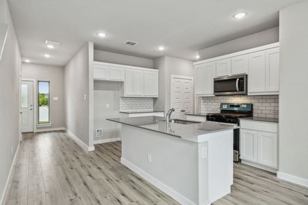 Kitchen in the Mesquite home plan by Trophy Signature Homes – REPRESENTATIVE PHOTO