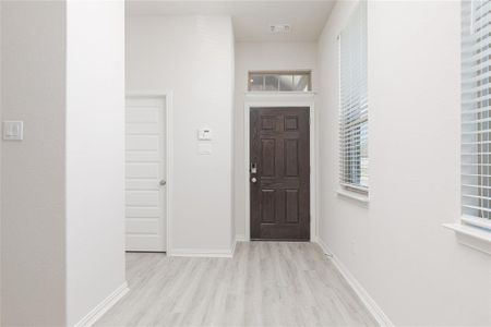 Foyer entrance featuring light hardwood / wood-style floors