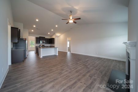 Family Room into Kitchen. Photo representation. Colors and options will differ.