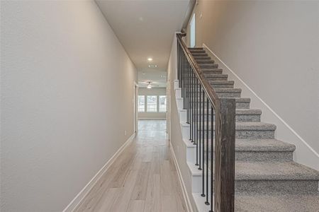 The entryway features access to the second story as well as the hall to the main living area.