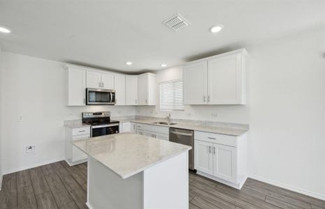 Spacious kitchen with ample cabinet space *real home pictured