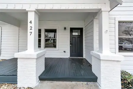 View of exterior entry featuring a porch