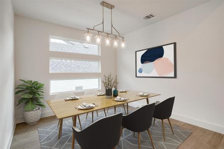 Dining area with hardwood / wood-style floors