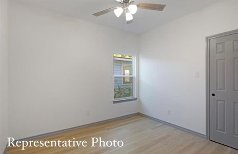 Spare room with ceiling fan and light hardwood / wood-style flooring