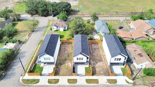 An aerial view of a spacious subdivision lot, highlighting a fully fenced perimeter, offering a lot of privacy.