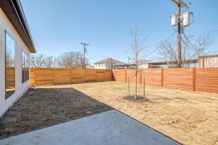 View of yard featuring a fenced backyard and a patio area