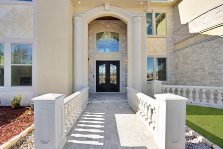 Property entrance featuring french doors