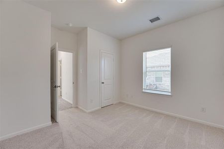 Unfurnished room with light carpet