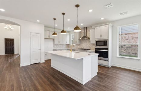 Airy kitchen with ample cabinet space*real home pictured