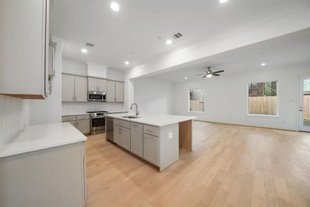 Open and bright, the kitchen opens up to the living and dinning areas. (Sample photos of a completed Lisbon floor plan. The image may feature alternative selections and/or upgrades.)