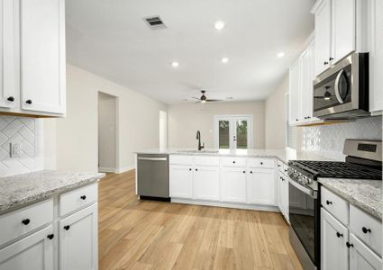 A spacious kitchen with lots of counterspace and storage