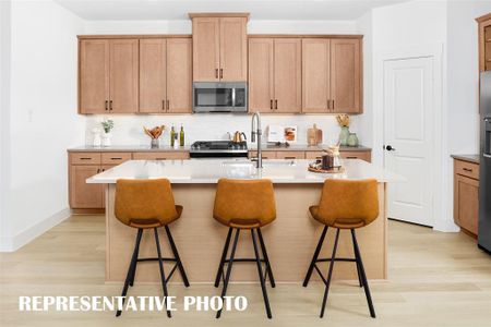 Chef inspired kitchens featuring large islands and plenty of storage are plentiful in many of our homes in Solterra!  REPRESENTATIVE PHOTO