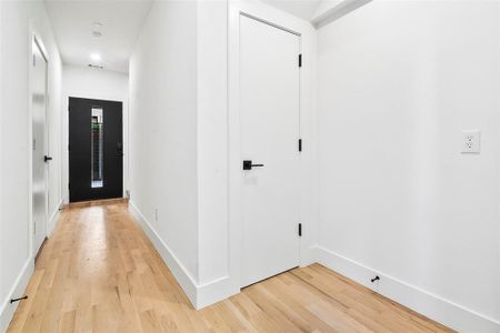 Corridor with light hardwood  floors