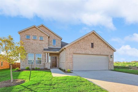 Craftsman inspired home with a garage and a front lawn