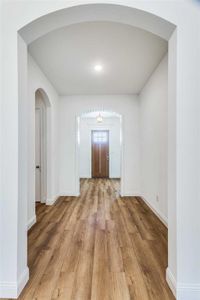 Hallway with wood-type flooring