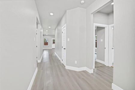 Hall featuring light hardwood / wood-style flooring