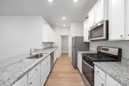 Kitchen with upgraded Whirlpool kitchen appliances.