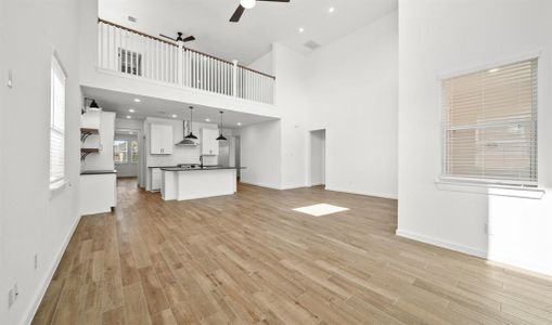 The spectacular kitchen opens to the supersized family room. Just look at this fantastic view!