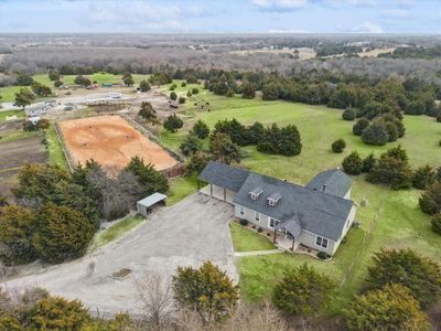 Birds eye view of property featuring a rural view