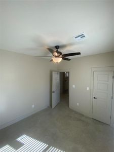 Unfurnished bedroom with ceiling fan