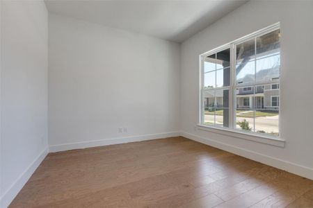 Unfurnished room with hardwood / wood-style floors