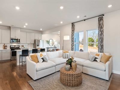 Large windows allow light to flood into the open-concept living space.