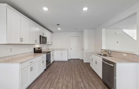 Bright kitchen with ample cabinet space*real home pictured