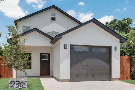 View of front facade featuring a garage