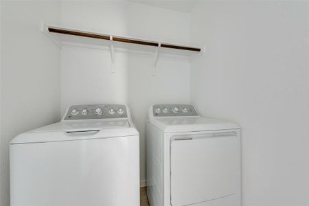 Washroom featuring separate washer and dryer