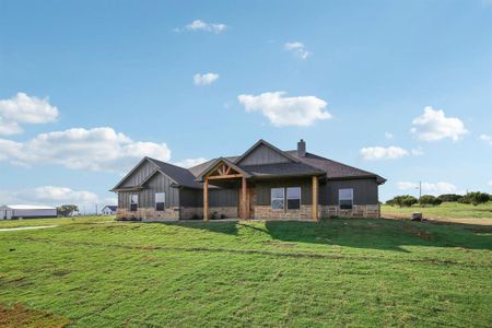 Craftsman-style house with a front lawn