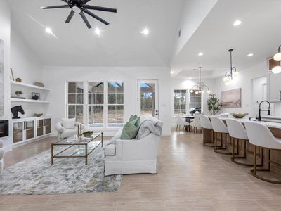 The open concept allows you to truly appreciate every inch of this home's space. The living room perfectly oversees the back patio, along with allowing the perfect amount of space to the kitchen island.