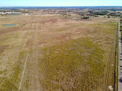 Birds eye view of property with a rural view