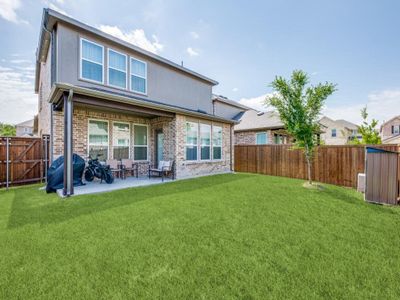 Back of property featuring a patio area, a fenced backyard, and brick siding Back of property featuring a patio area, a fenced backyard, and brick siding