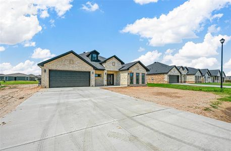 View of front of home featuring a garage