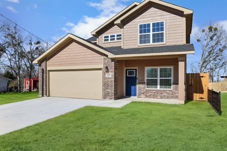 Craftsman-style home with a garage and a front lawn