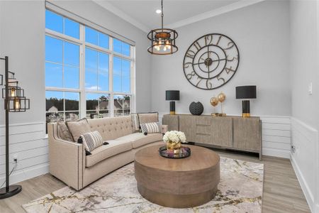 The dining room serves as additional living space for this seller, has upgraded lighting and shiplap.