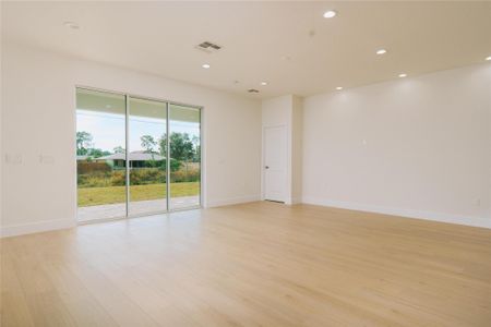 8' triple sliding glass doors welcoming abundance of natural light