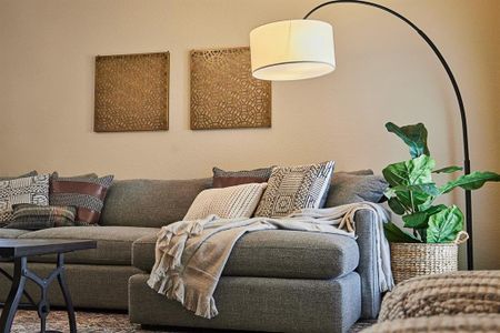 The spacious living room is open to the dining area and the kitchen.