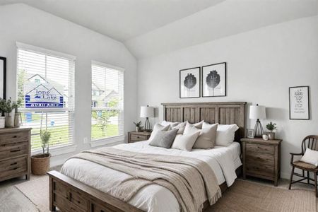 Secondary bedroom features plush carpeting, large windows that let in plenty of natural light, bright paint, and spacious closets. Virtually staged.