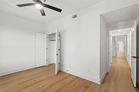 Unfurnished bedroom featuring light hardwood / wood-style flooring and ceiling fan