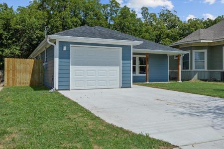 Single story home featuring a front lawn