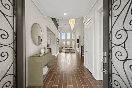 Virtually Staged: You'll be instantly greeted by beautiful new tile floors, a charming stair case, and a view straight back into the backyard!